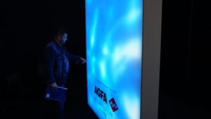 Visitor interacting with the water projection panel.