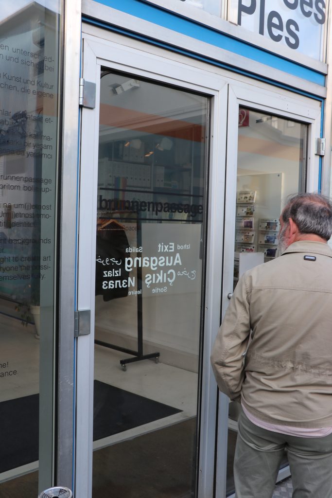 A man opens a door.