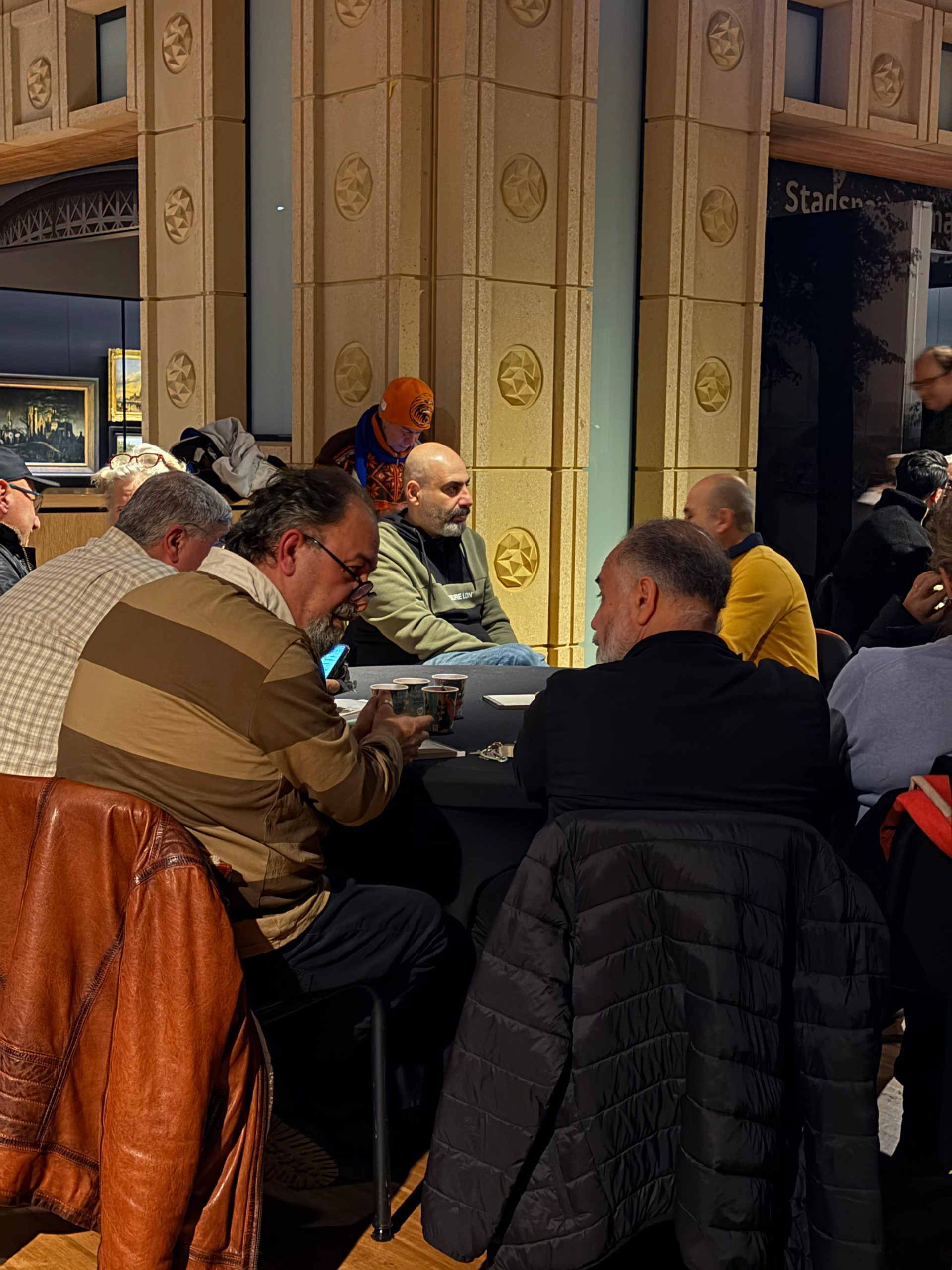 people talking at gathering in Arnhem. Photo: Chimène de Jonge